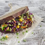 Delicious healthy vegetarian open cole slaw and a chickpea sandwich. On light wooden rustic background
